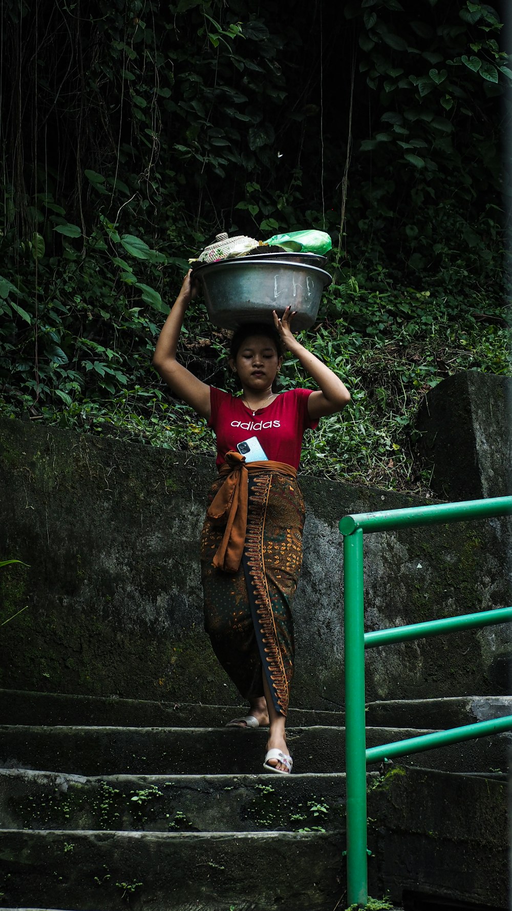 a person holding a bowl of food