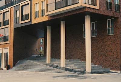 A striking urban facade blending concrete and wood textures with innovative geometric shapes.