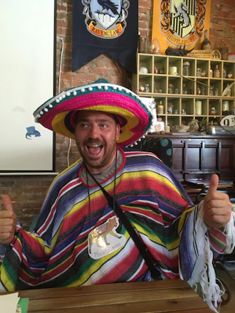 A friendly financial advisor helping a Mexican family understand their pension options.
