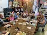 Seniors enjoying a group activity in a warm, welcoming space.
