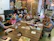 A warm, inviting room with soft lighting and cozy seating where adults engage in a group activity.