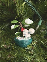 An animated scene showing a tiny teacher pointing at a digital shield protecting a holiday card.