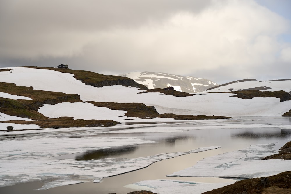 a snowy landscape with a car driving