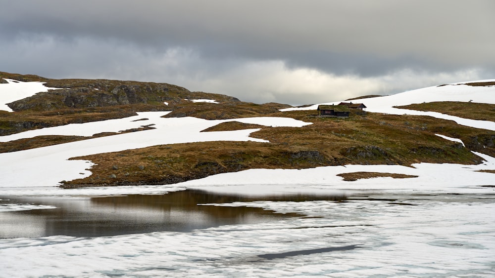 a snowy landscape with a house