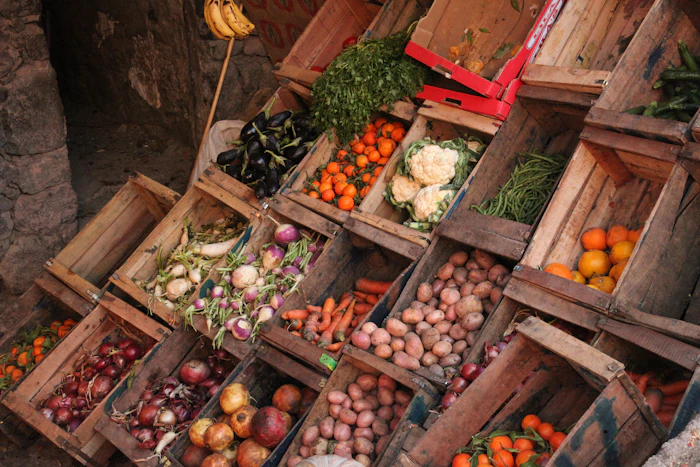 Onions and vegetables in market crates