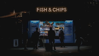 people standing in front of a display