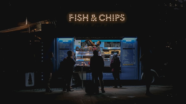 people standing in front of a display