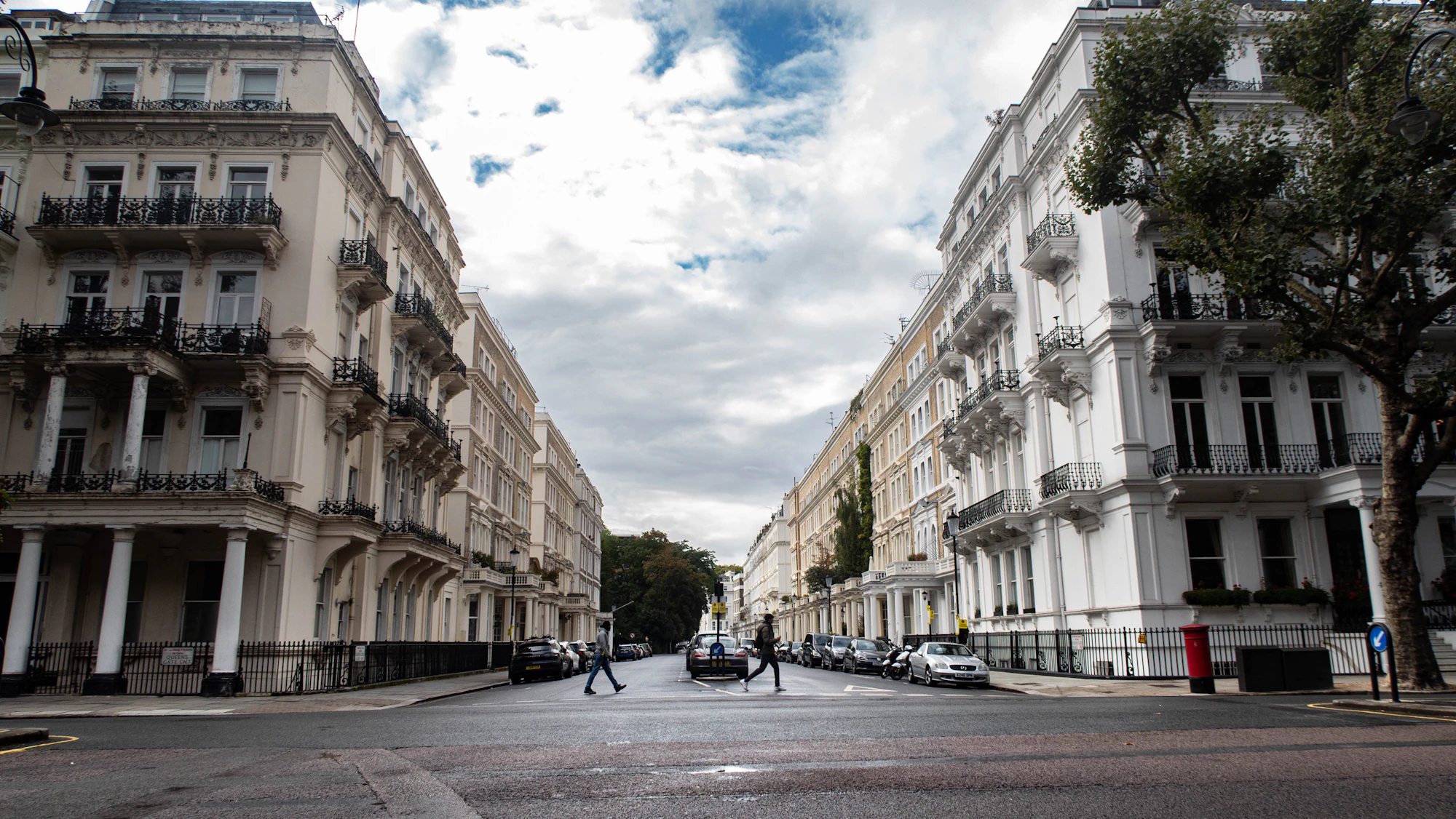White stucco townhouses on a quiet South Kensington street