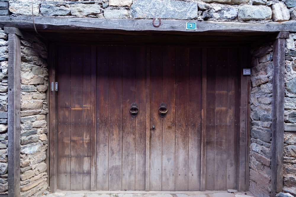 a wooden door in a stone building