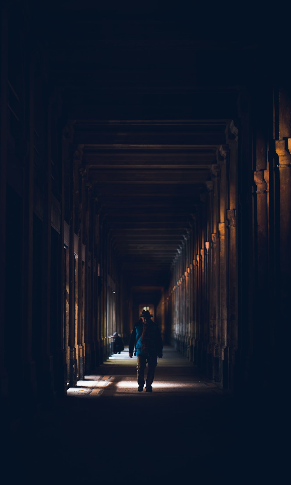 a man and woman standing in a hallway