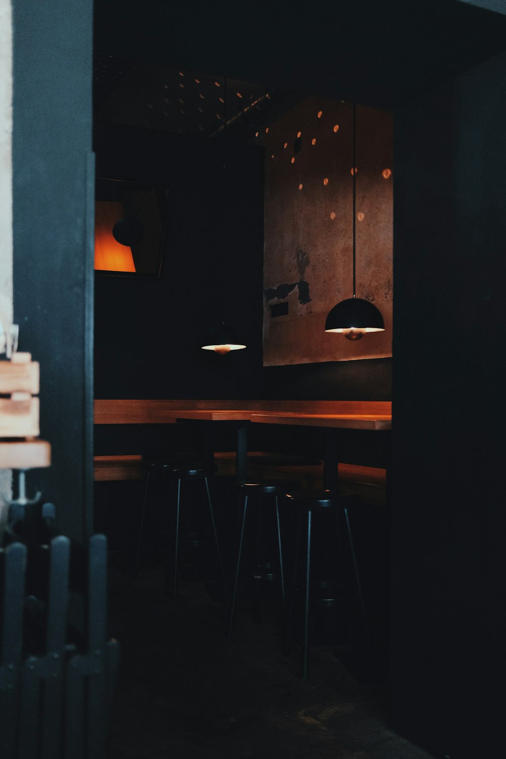 a table and chairs in a dark room