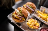 a couple of burgers with fries
