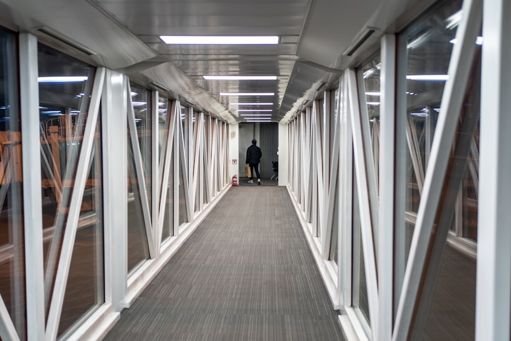 a person walking down a long hallway
