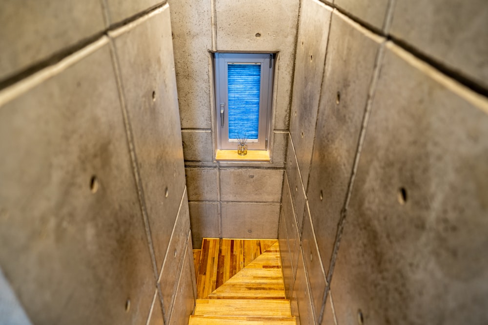 a wooden staircase with a window