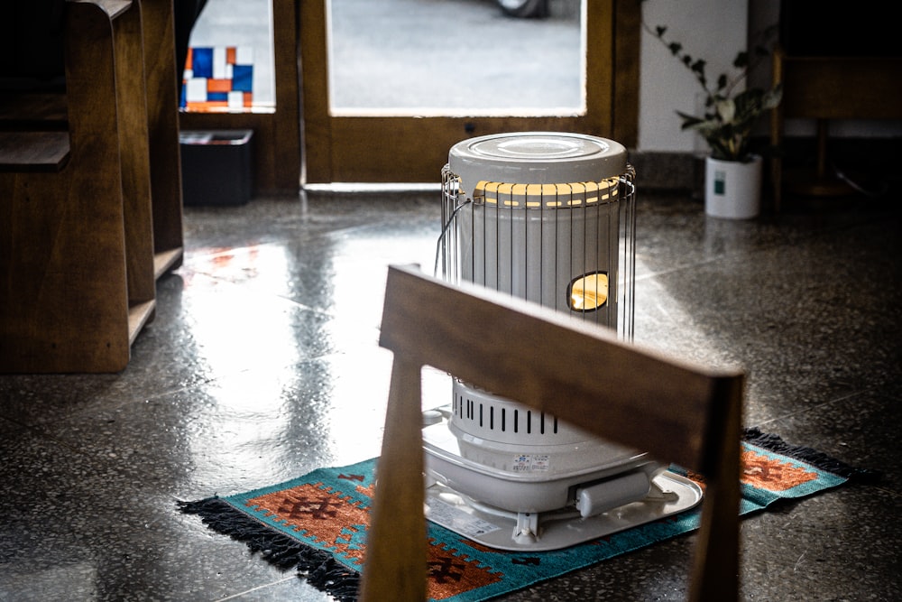 a metal cage on a rug