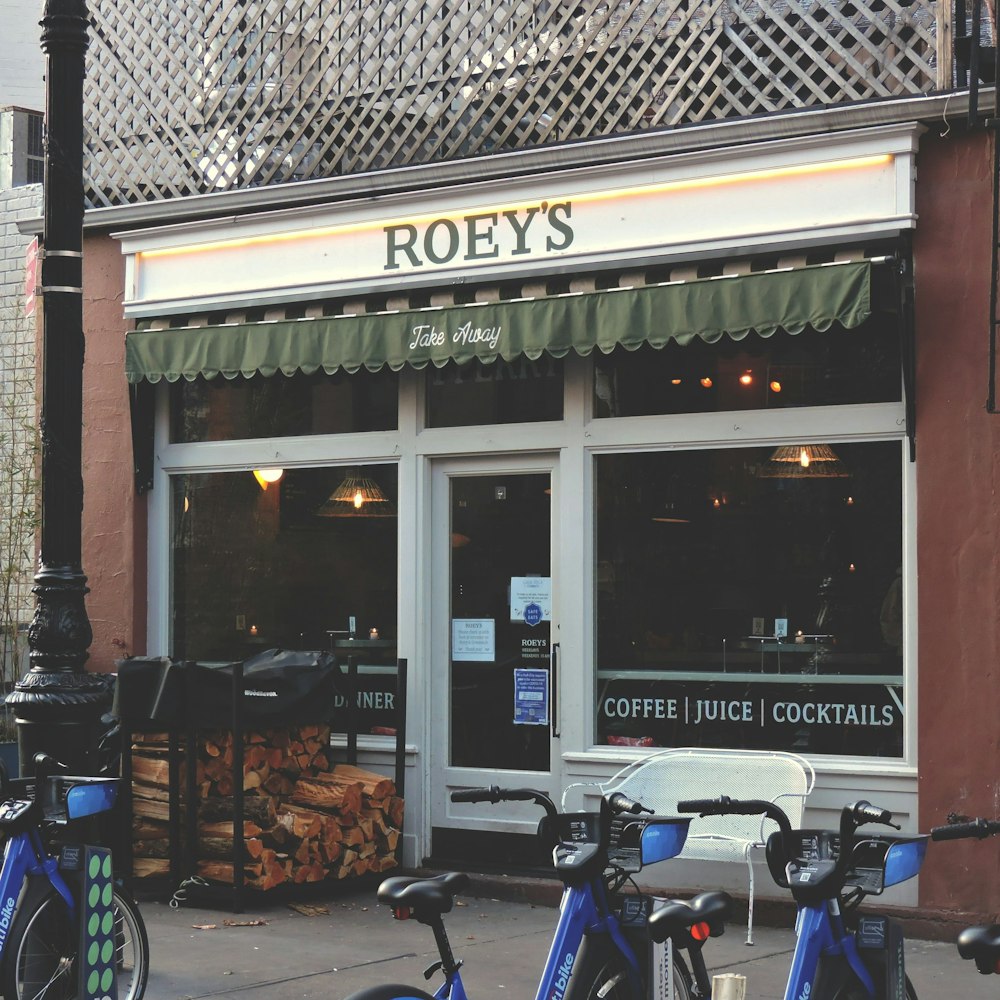 a store front with bicycles parked in front