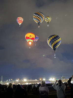 Evening shot capturing the event’s lively atmosphere under lights.