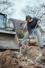 a man digging in the dirt