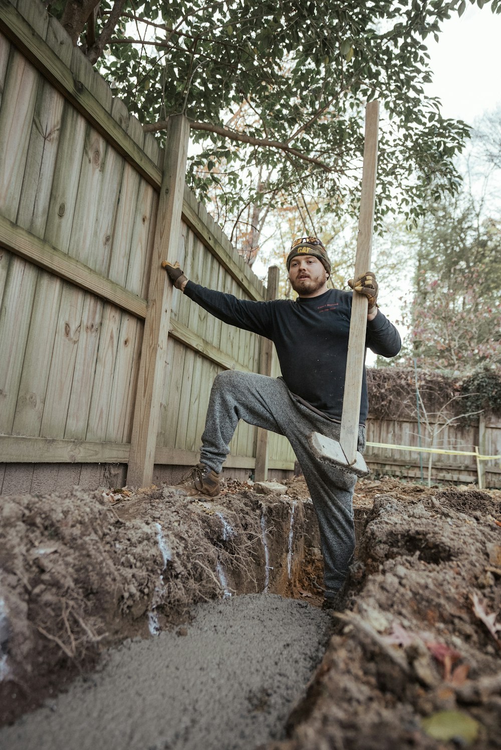 a man holding a shovel