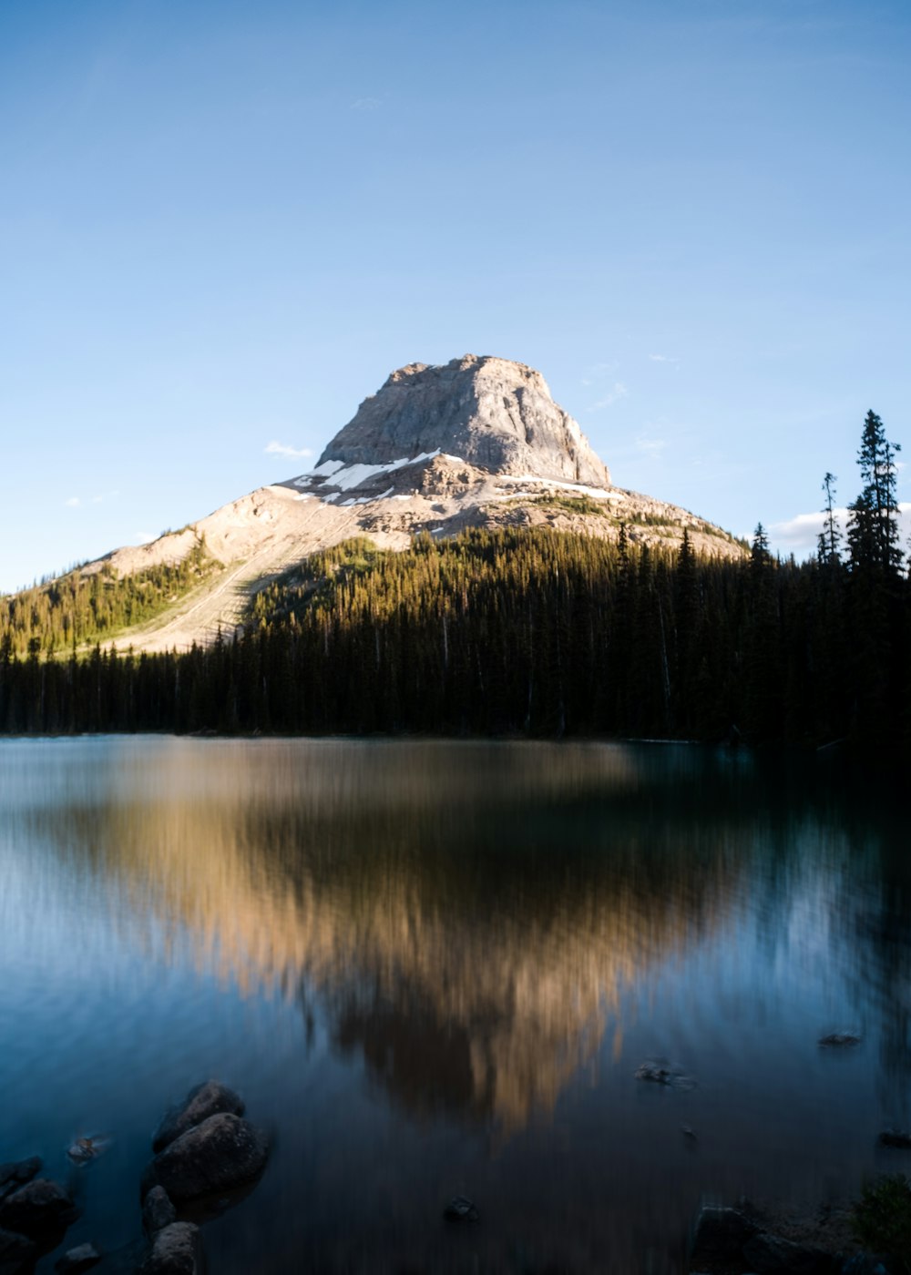 a mountain reflected in a lake