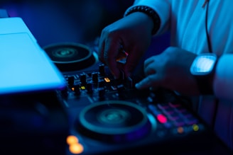 a person mixing on Dj controller