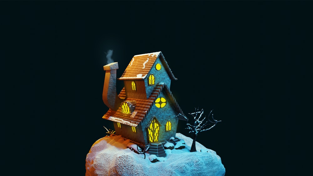 a toy house on a snowy hill