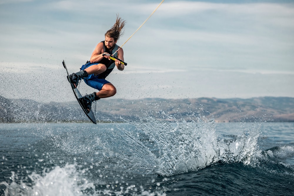 a man parasailing on a water ski