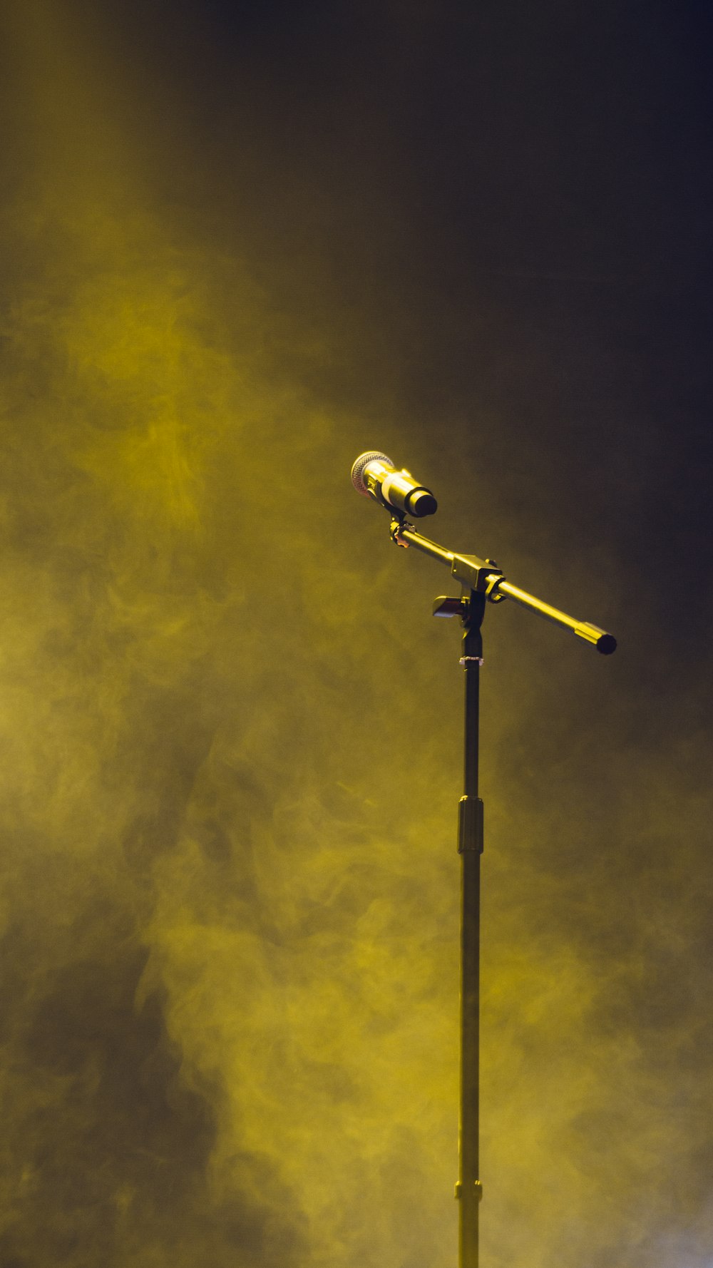 a street light with a fire in the background