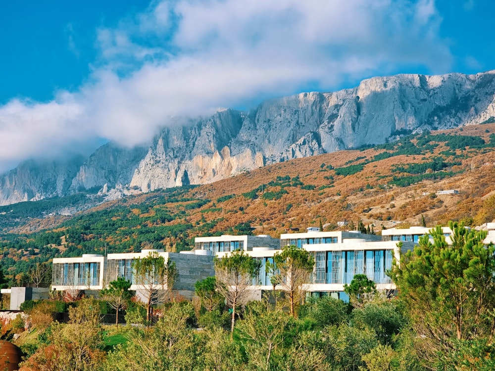 a building with a mountain in the background