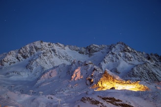 a snowy mountain in val thorens  with a fire in the middle