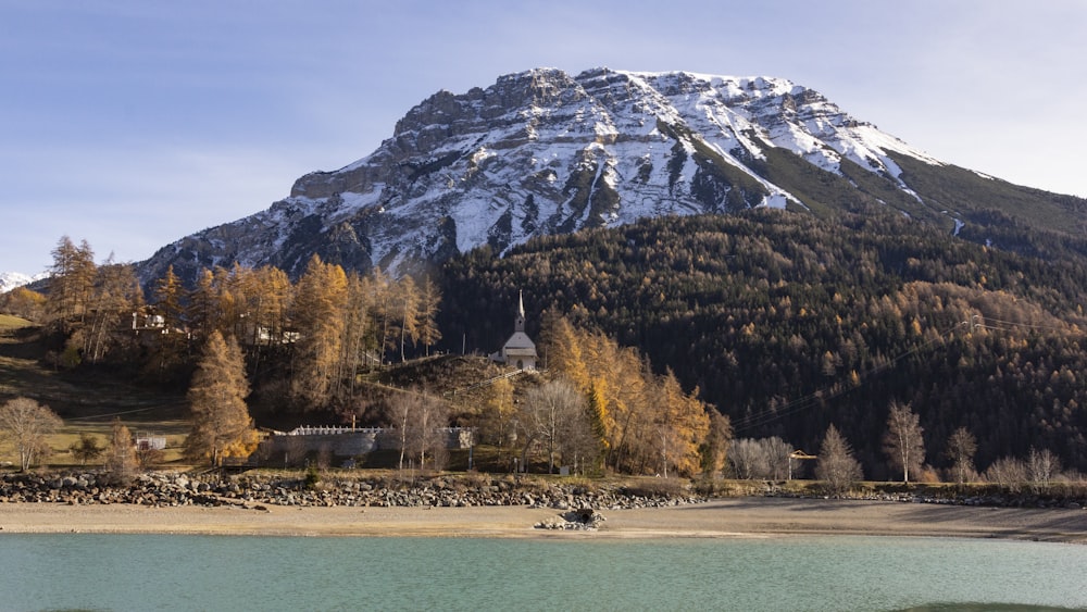 a body of water with a mountain in the background