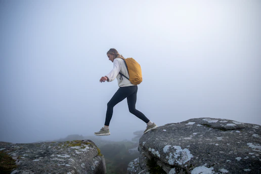 a man walking on a rock