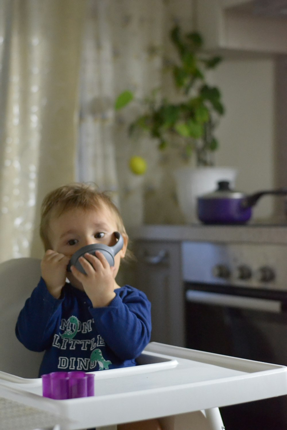 a boy holding a phone