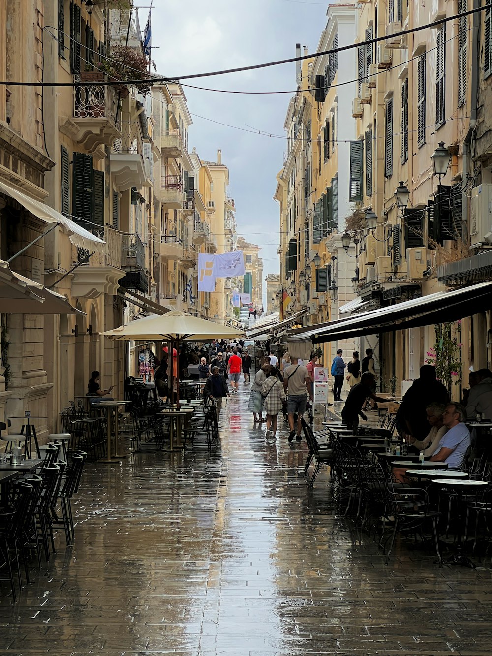 people walking on a wet street