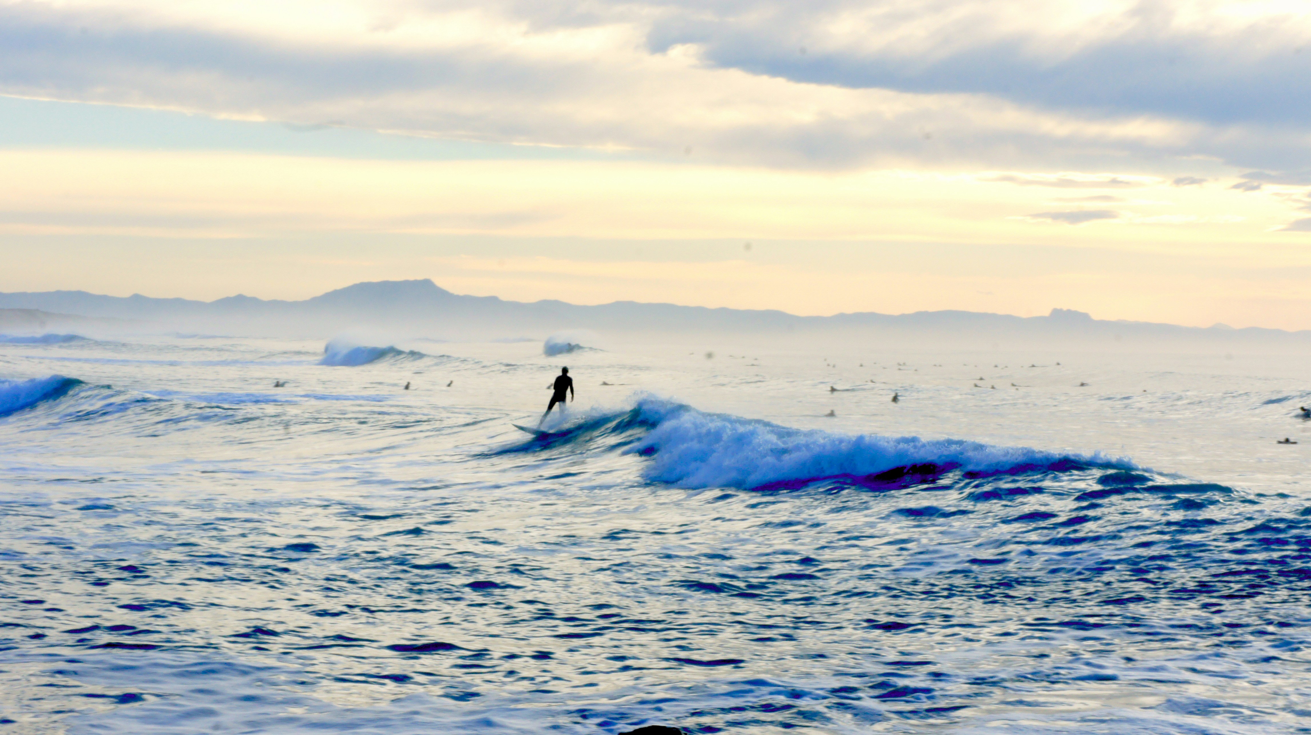 a person surfing on the waves