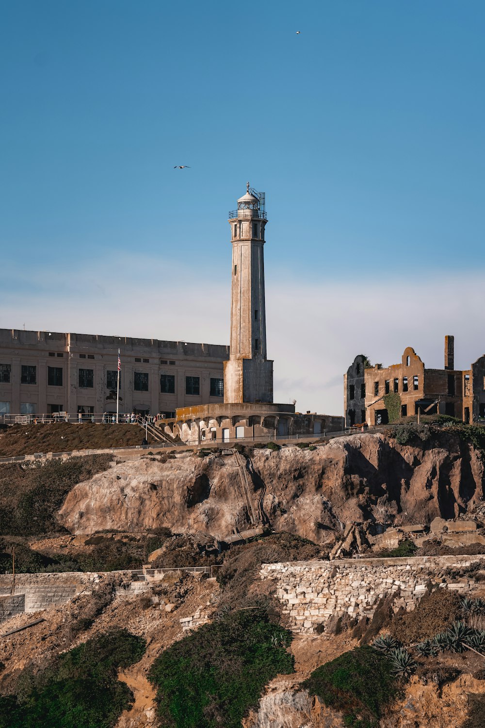 a tall tower on a rocky hill