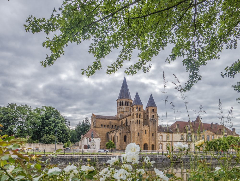 a castle with a garden in front of it