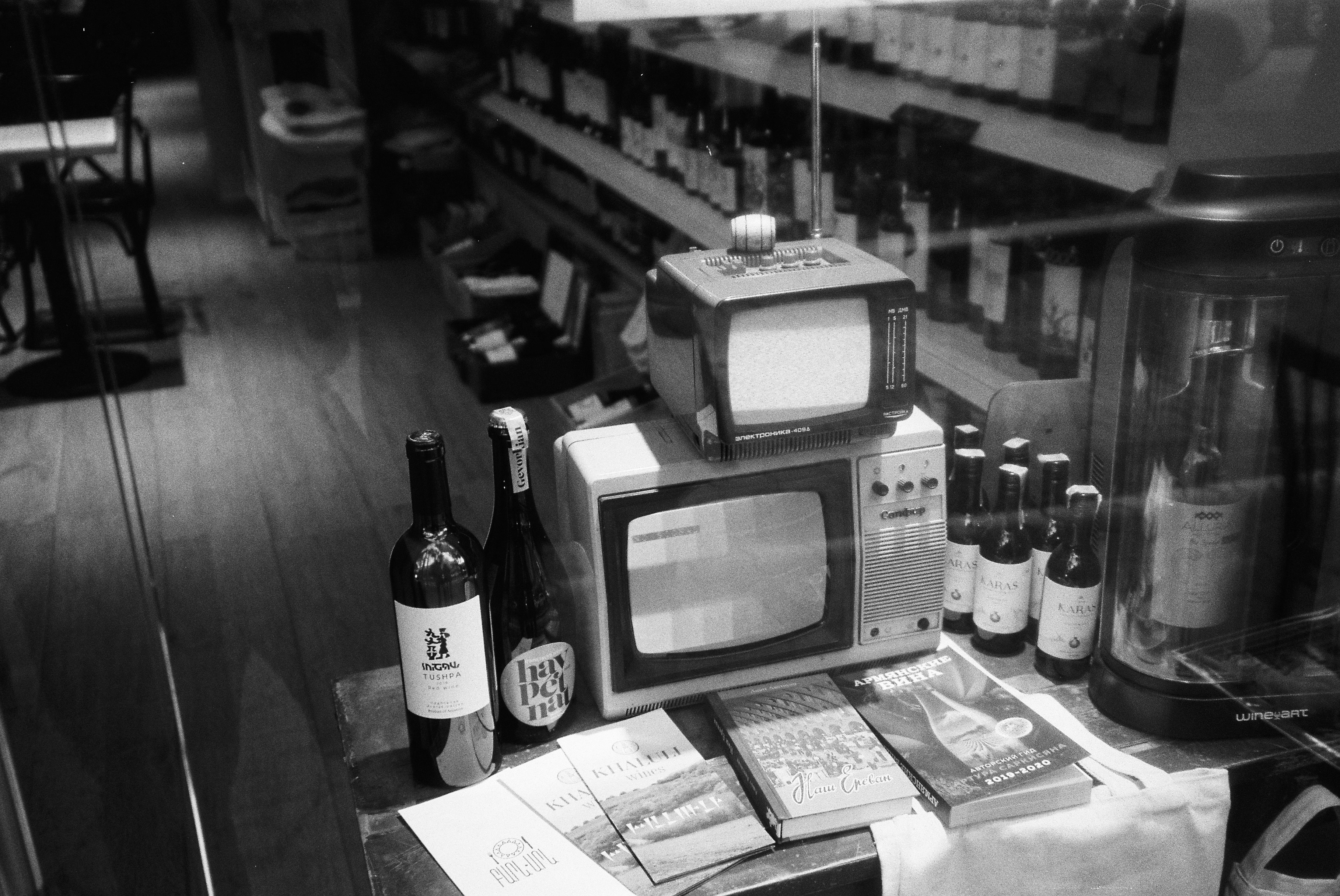 a microwave oven and bottles of alcohol