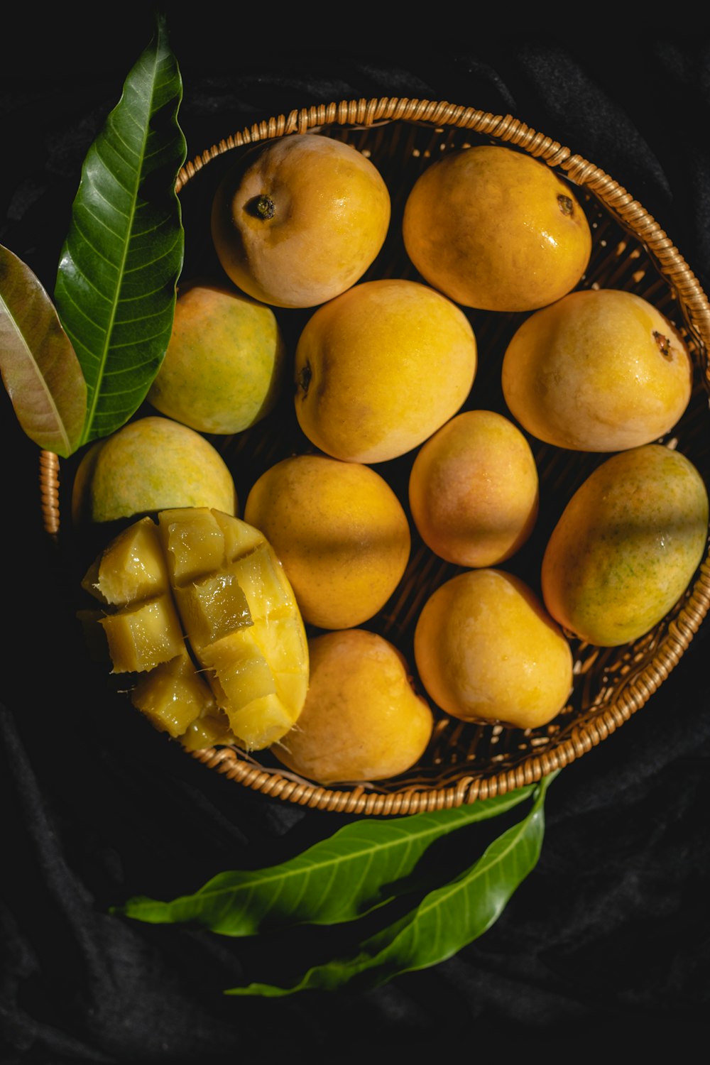 a basket of yellow and green fruit