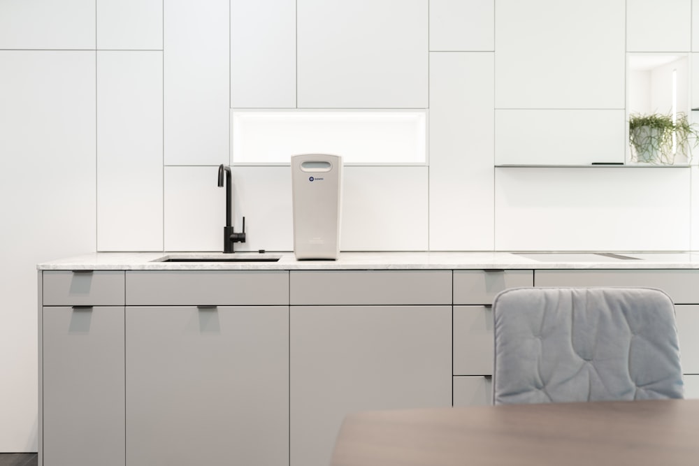 a white kitchen with white cabinets