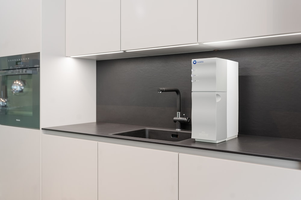 a kitchen with a sink and refrigerator