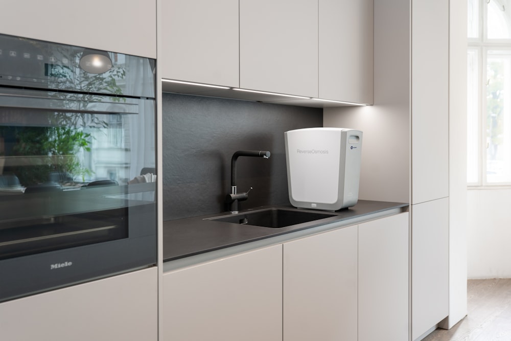 a kitchen with white cabinets