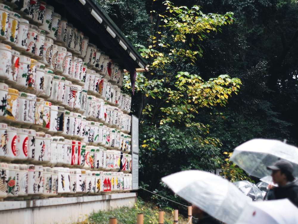 a wall with signs and umbrellas