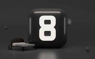 a black rectangle with a white circle and a white circle on it