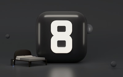 a black rectangle with a white circle and a white circle on it