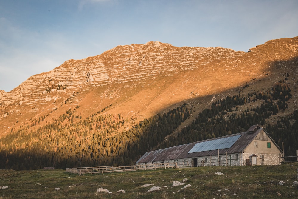 a building in front of a mountain