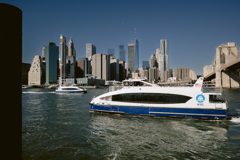 a boat in the water with a city in the background