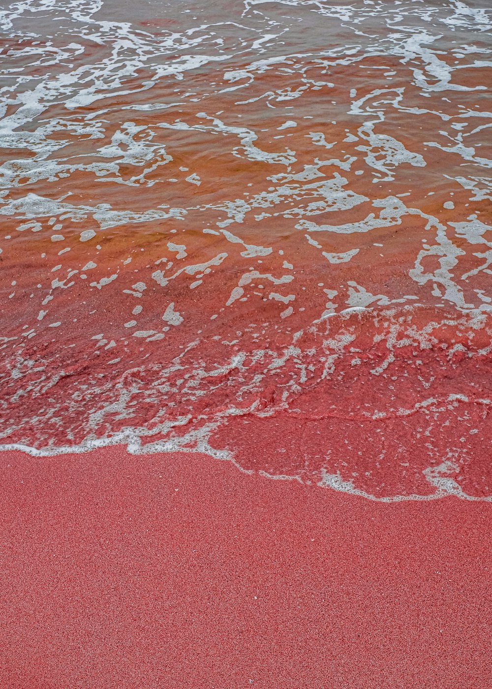 a close up of a red surface