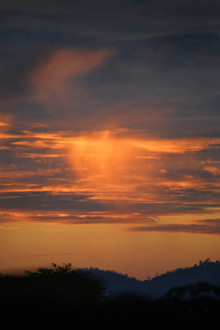 Sunset over mountains — atmospheric background