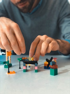 a man building a building blocks